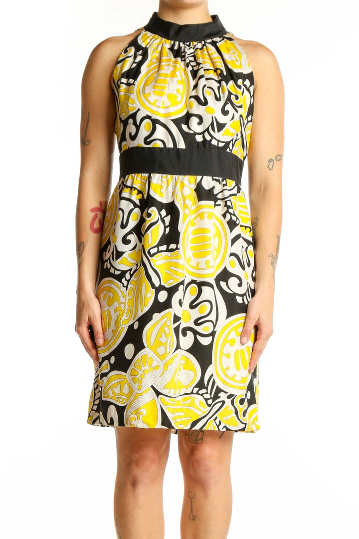 Yellow and black abstract silk halter dress with color-blocked waistband, front view