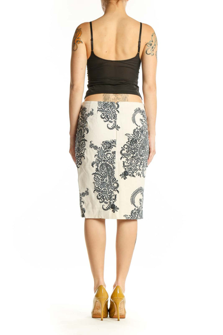 Back view of cream lace paisley pencil skirt showing fitted pencil cut and intricate black lace design