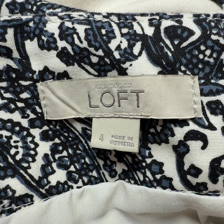Tag view of cream lace paisley pencil skirt showing fitted pencil cut and intricate black lace design