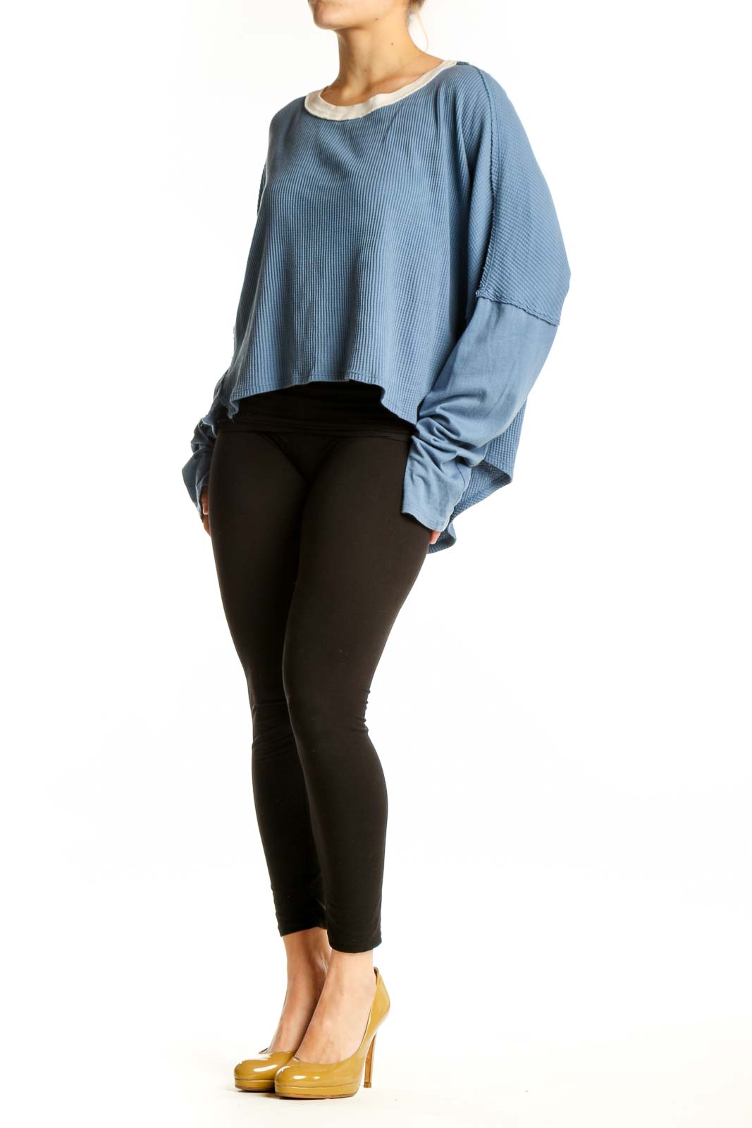 Blue ribbed cotton crop top with oversized sleeves and cream contrast trim, front view