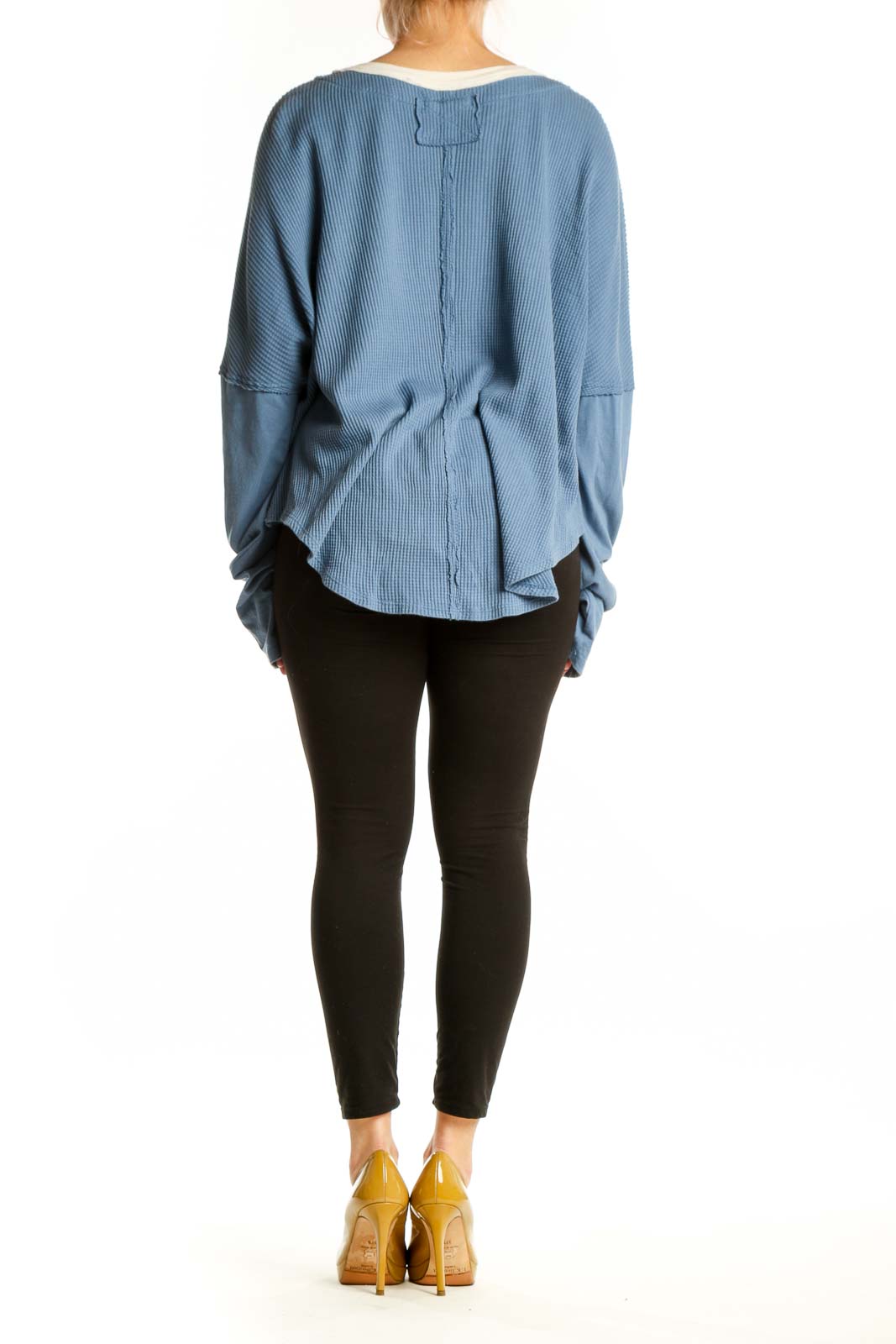 Blue ribbed cotton crop top with oversized sleeves and cream contrast trim, back view