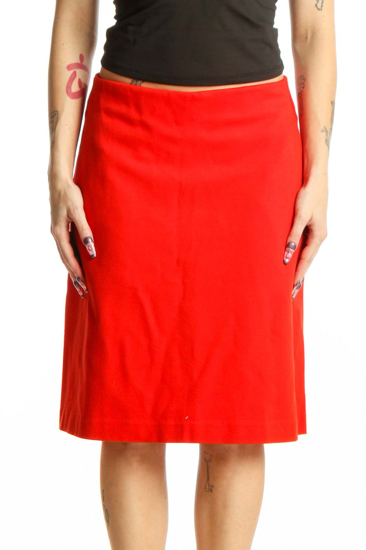 Red A-line midi skirt with pockets, front view on model wearing black top
