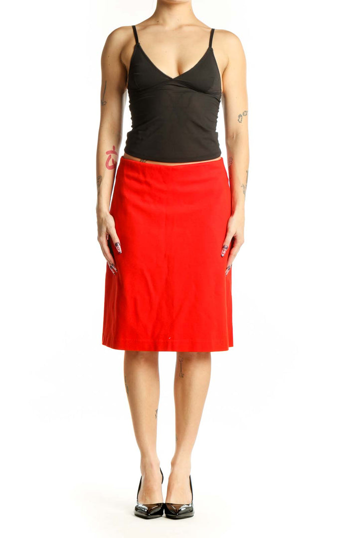 Red A-line midi skirt with pockets, front view on model wearing black top