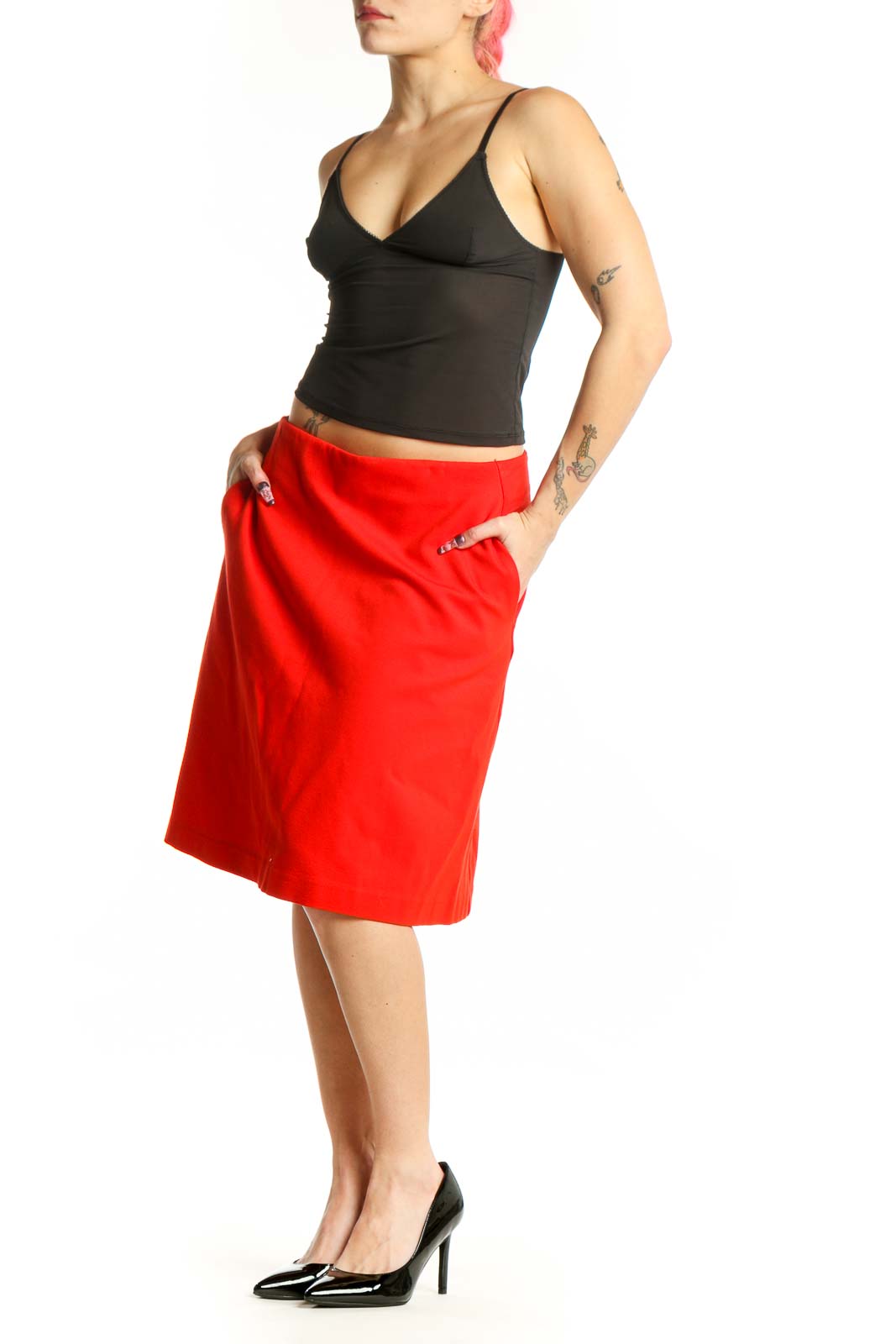 Red A-line midi skirt with pockets, front view on model wearing black top