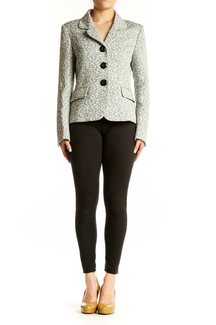 Cream jacquard tailored blazer with black button closures and notched lapels, front view