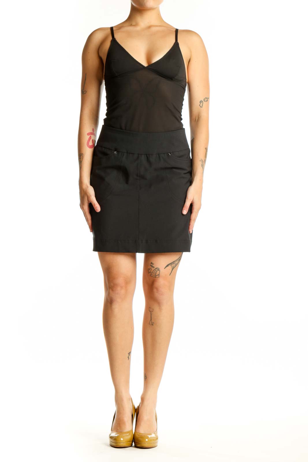 Hard Tail black mini skirt with elastic waistband and snap details, front view on model