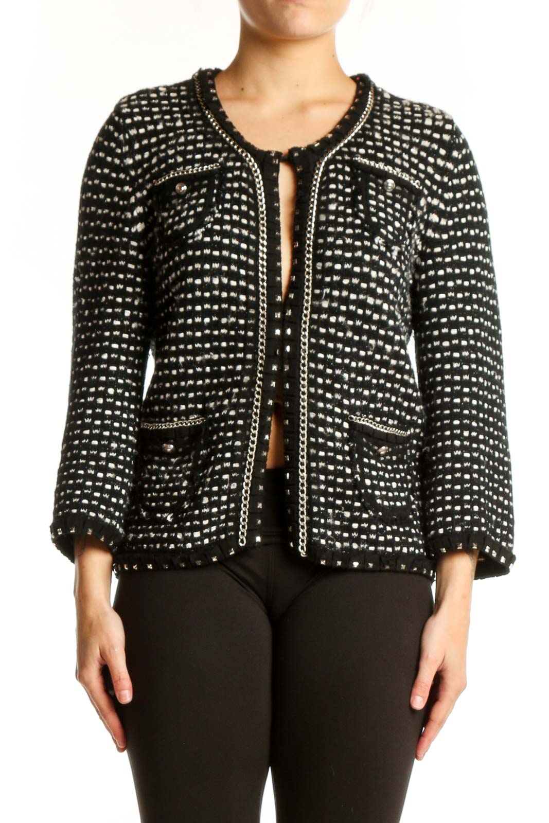 Black studded cropped jacket with all-over metallic studs, front view on model