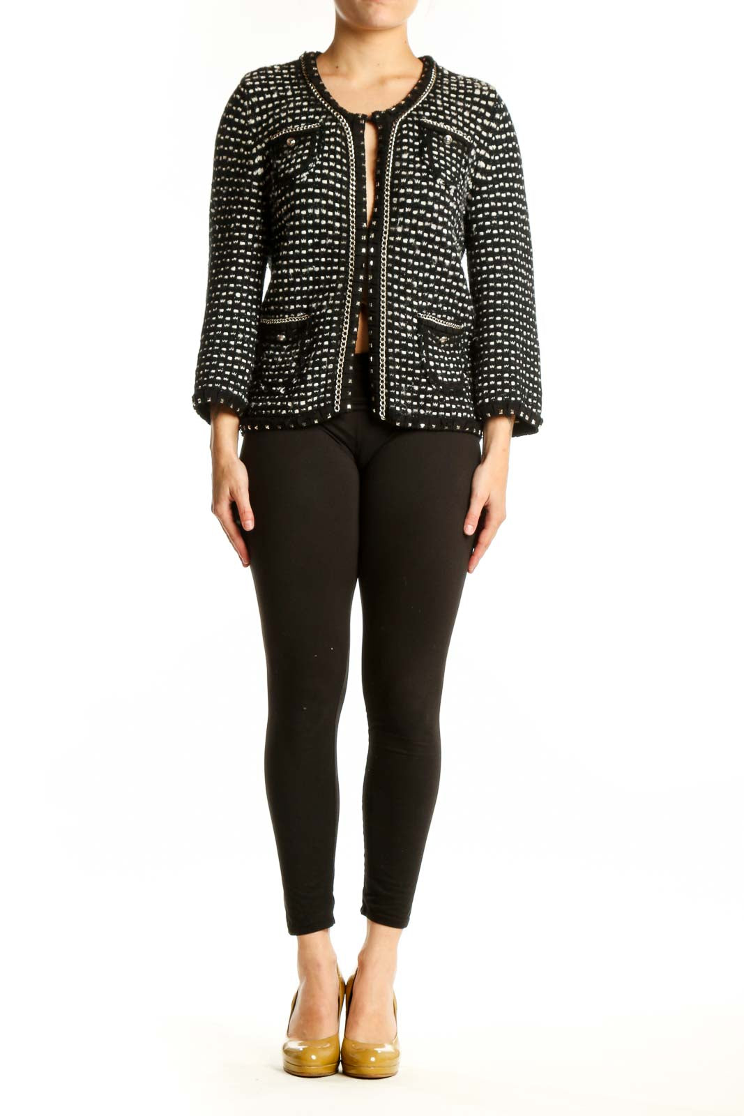 Black studded cropped jacket with all-over metallic studs, front view on model