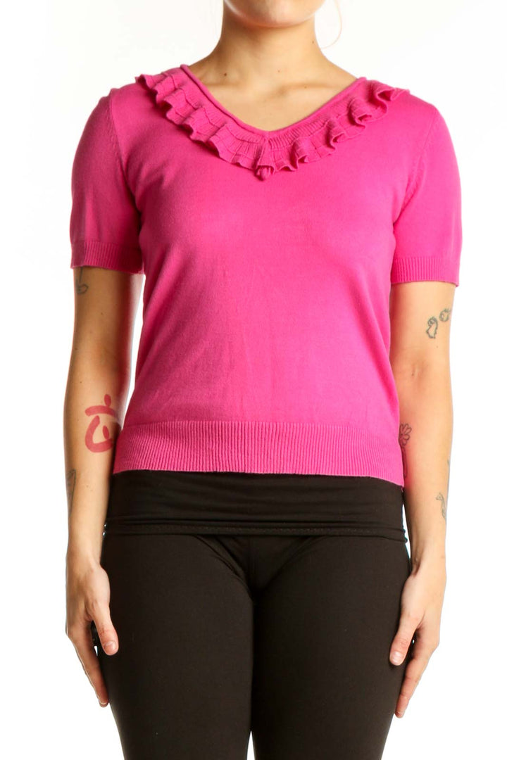 Pink ruffle V-neck short sleeve top with ruffled neckline detail, front view
