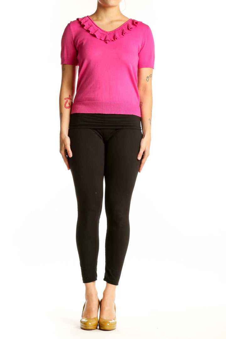 Pink ruffle V-neck short sleeve top with ruffled neckline detail, front view