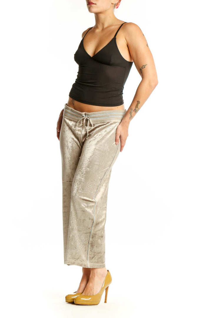 Front view of cream velvet cropped jogger pants with drawstring waistband by BCBG MaxAzria
