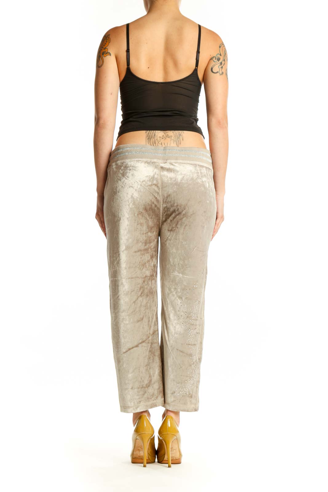 Back view of cream velvet cropped jogger pants showing relaxed fit and ankle length by BCBG MaxAzria