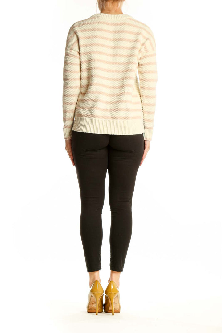 Cream and blush striped knit pullover sweater with cropped hem, back view