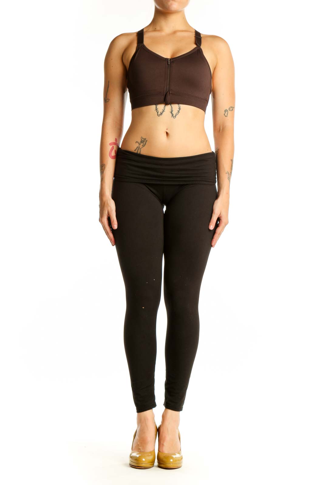 Black sports bra with front zip closure and adjustable straps, front view on model