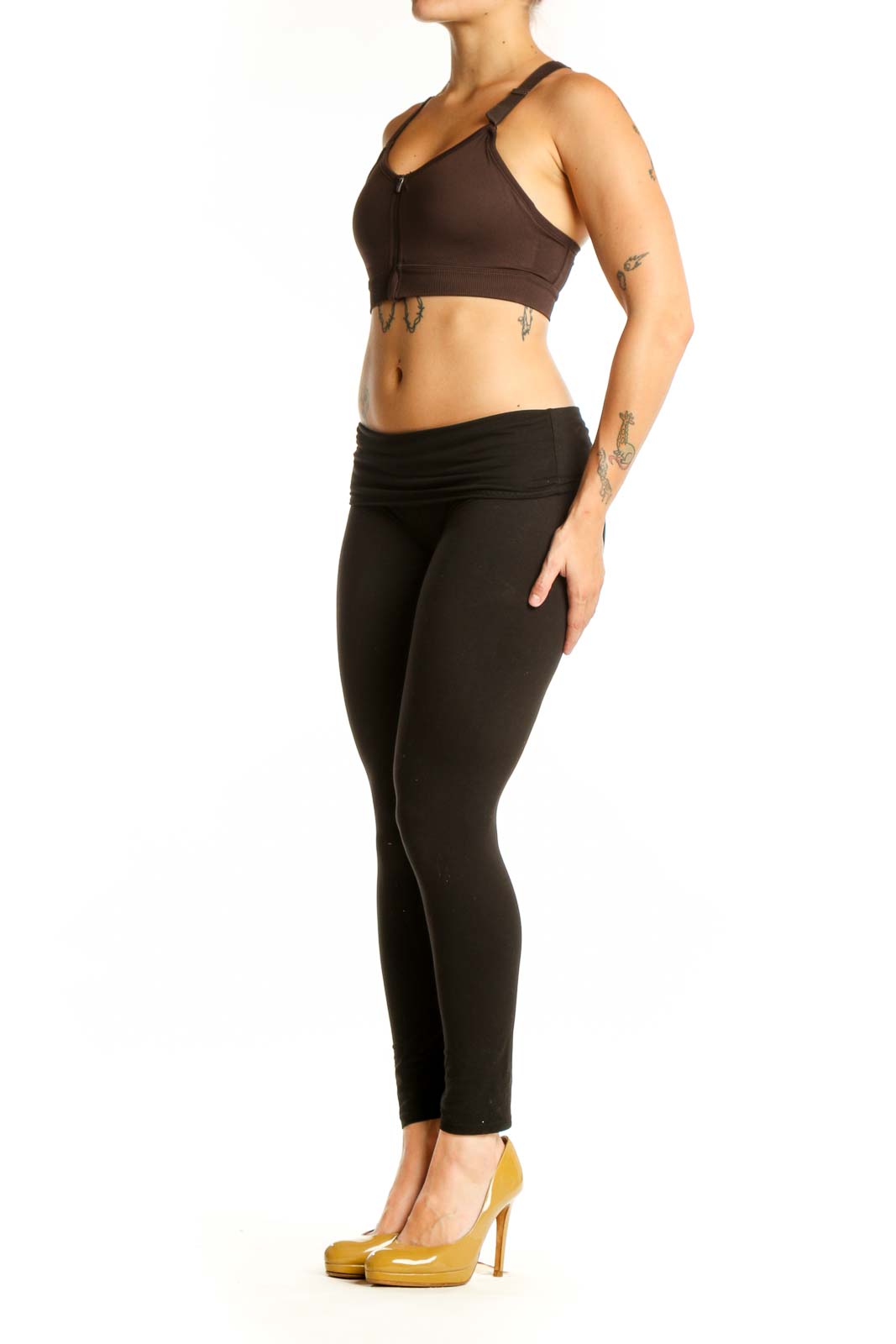 Black sports bra with front zip closure and adjustable straps, front view on model