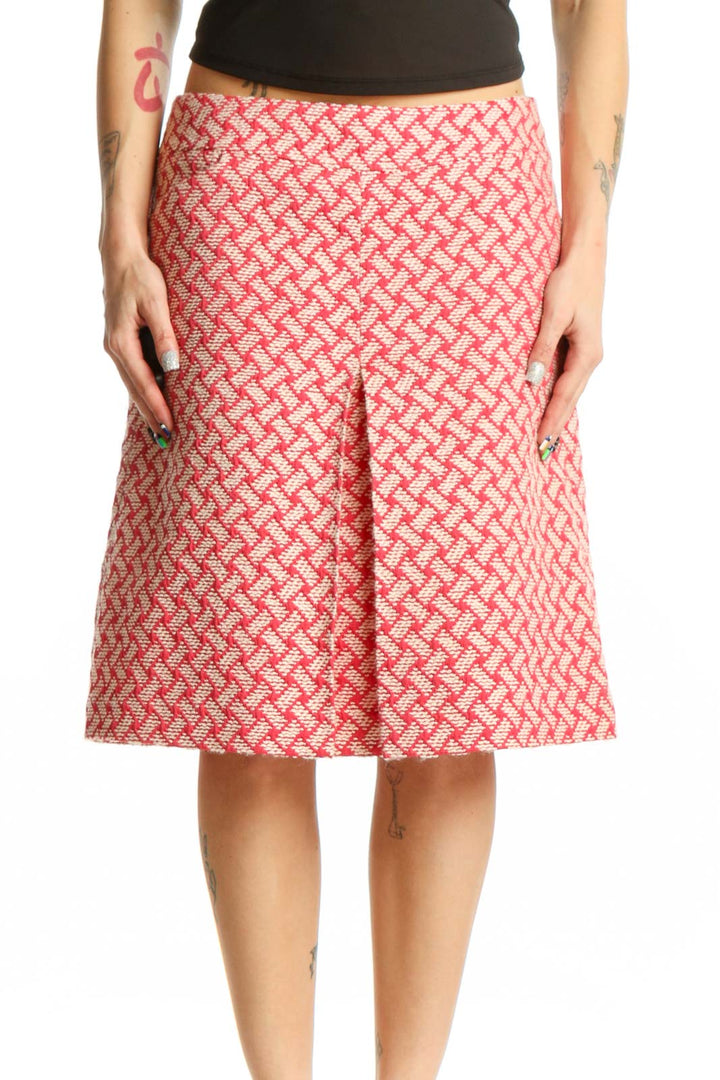 Pink geometric A-line skirt by Talbots with coral and cream lattice pattern, front view on model