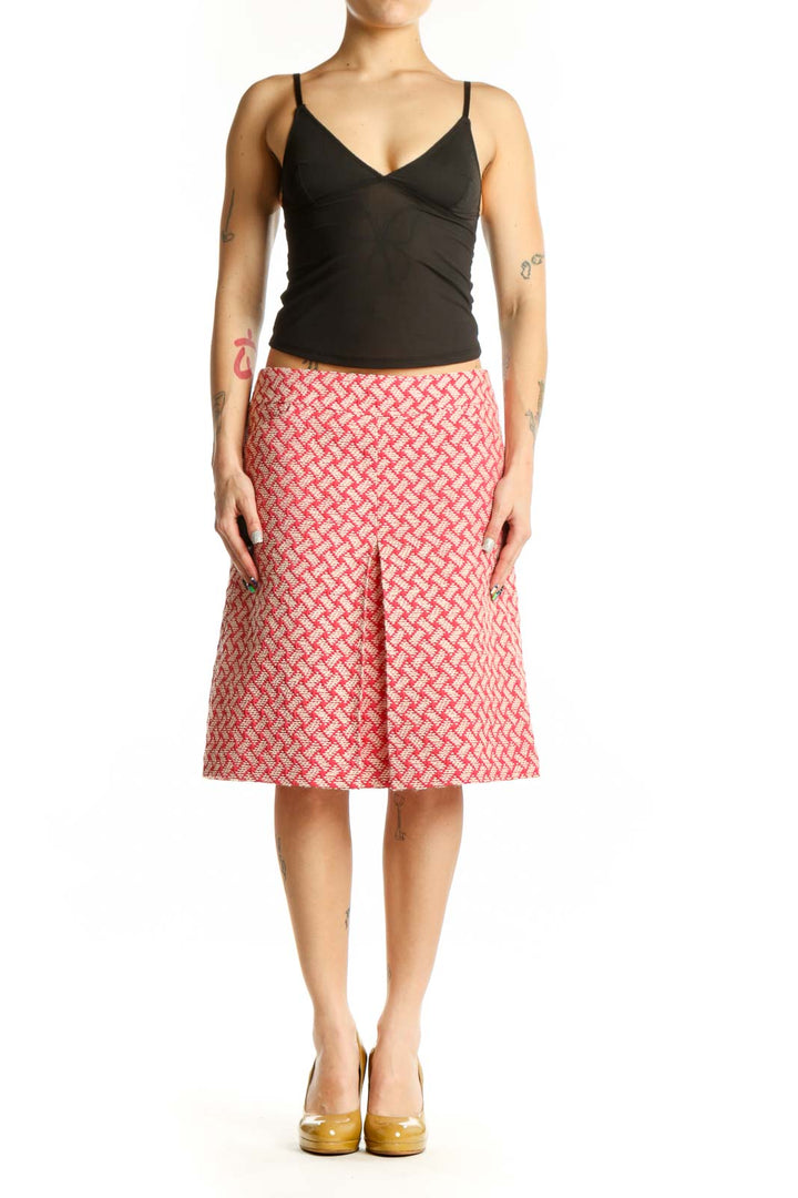 Pink geometric A-line skirt by Talbots with coral and cream lattice pattern, front view on model