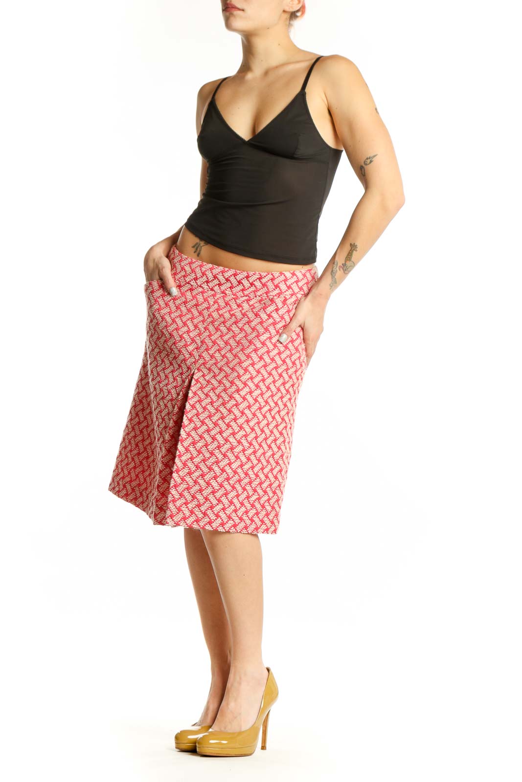 Pink geometric A-line skirt by Talbots with coral and cream lattice pattern, front view on model