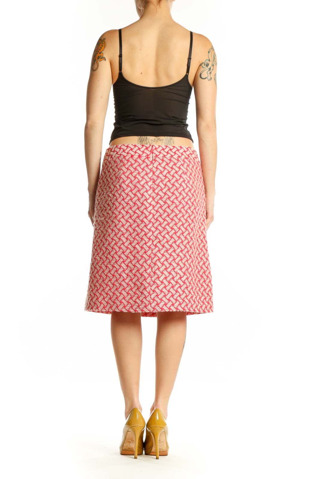 Pink geometric A-line skirt by Talbots with coral and cream lattice pattern, back view on model