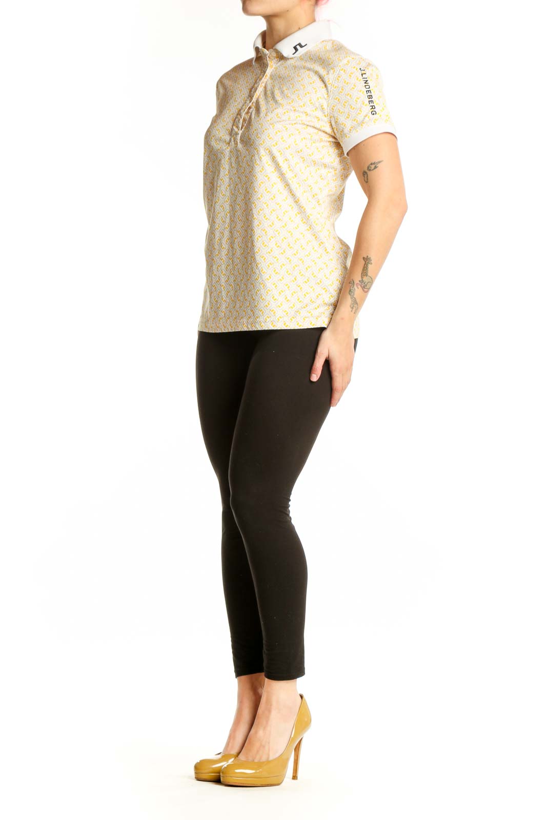 J. Lindeberg yellow geometric print polo shirt with white collar trim, front view on model