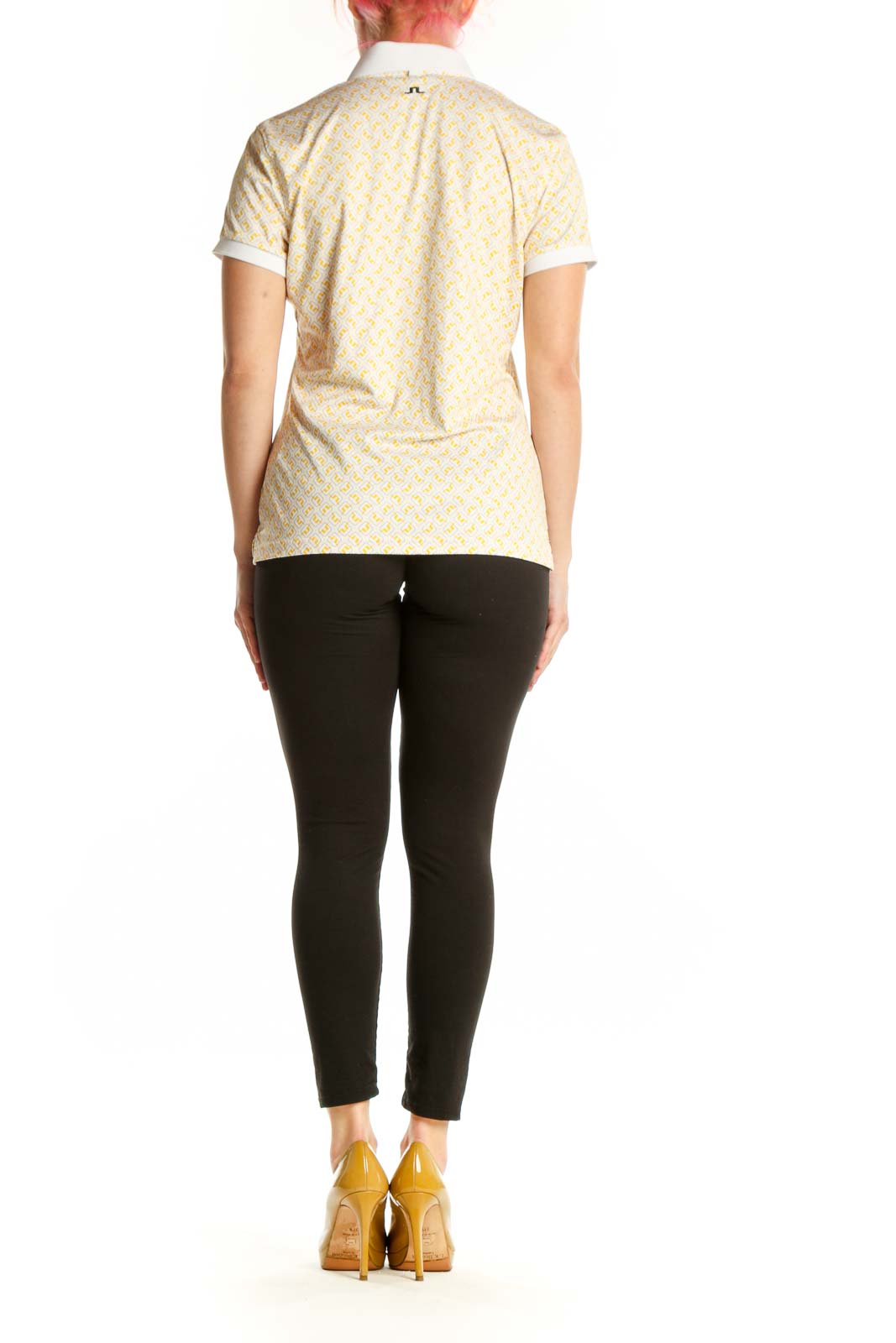 J. Lindeberg yellow geometric print polo shirt back view, showing full design and fit on model