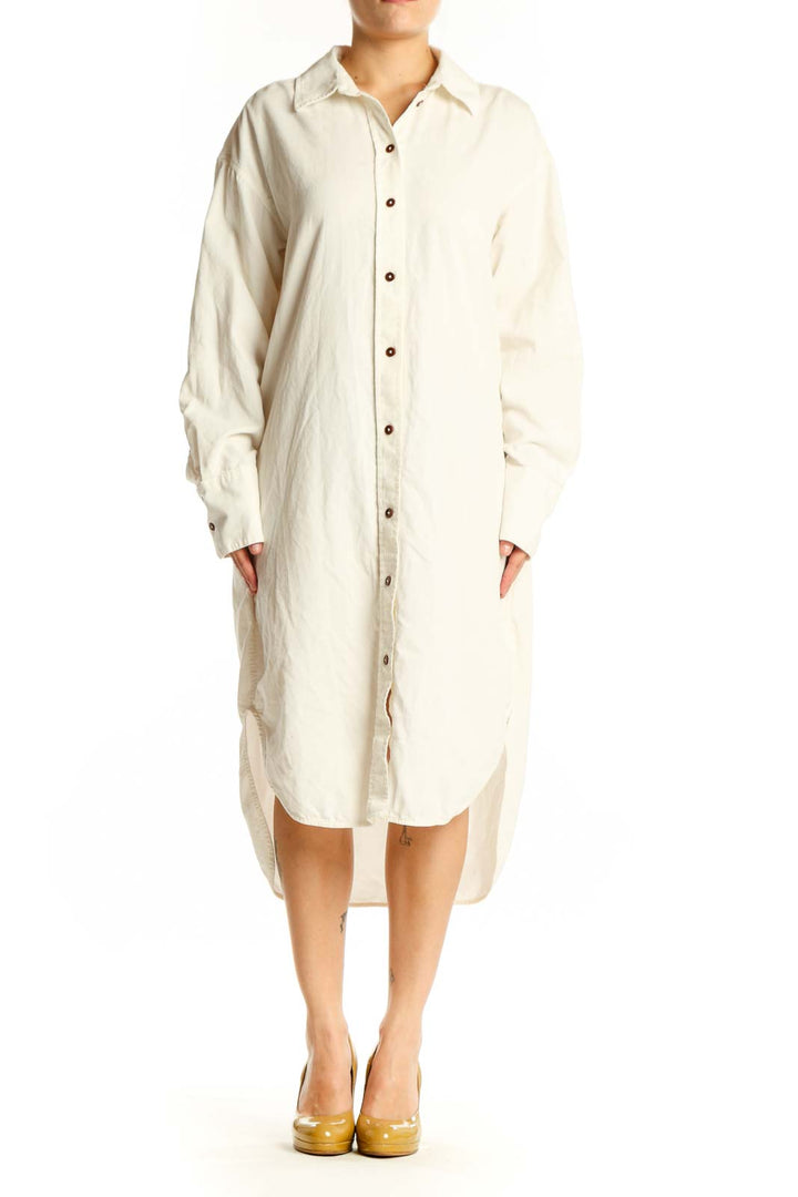 Cream cotton button-front shirt dress by Madewell, front view showing long sleeves and relaxed fit
