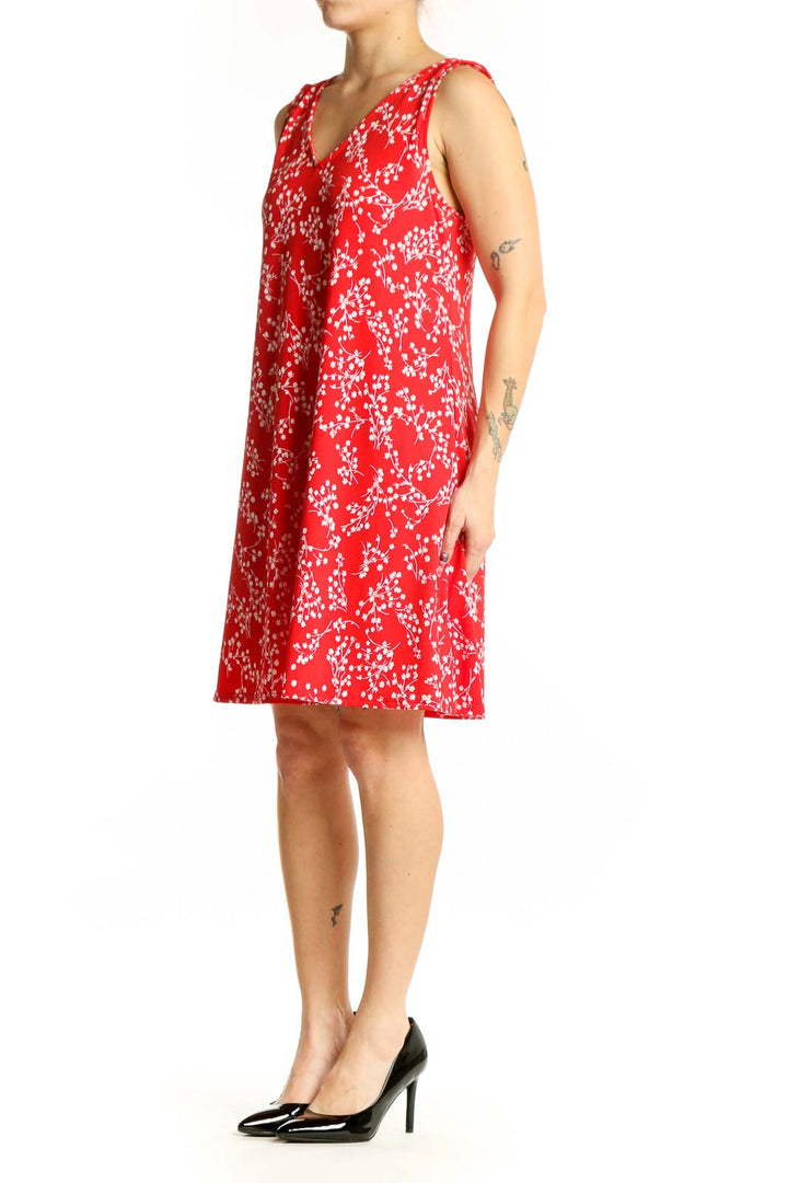 Red floral V-neck sleeveless A-line dress with white flower print, front view