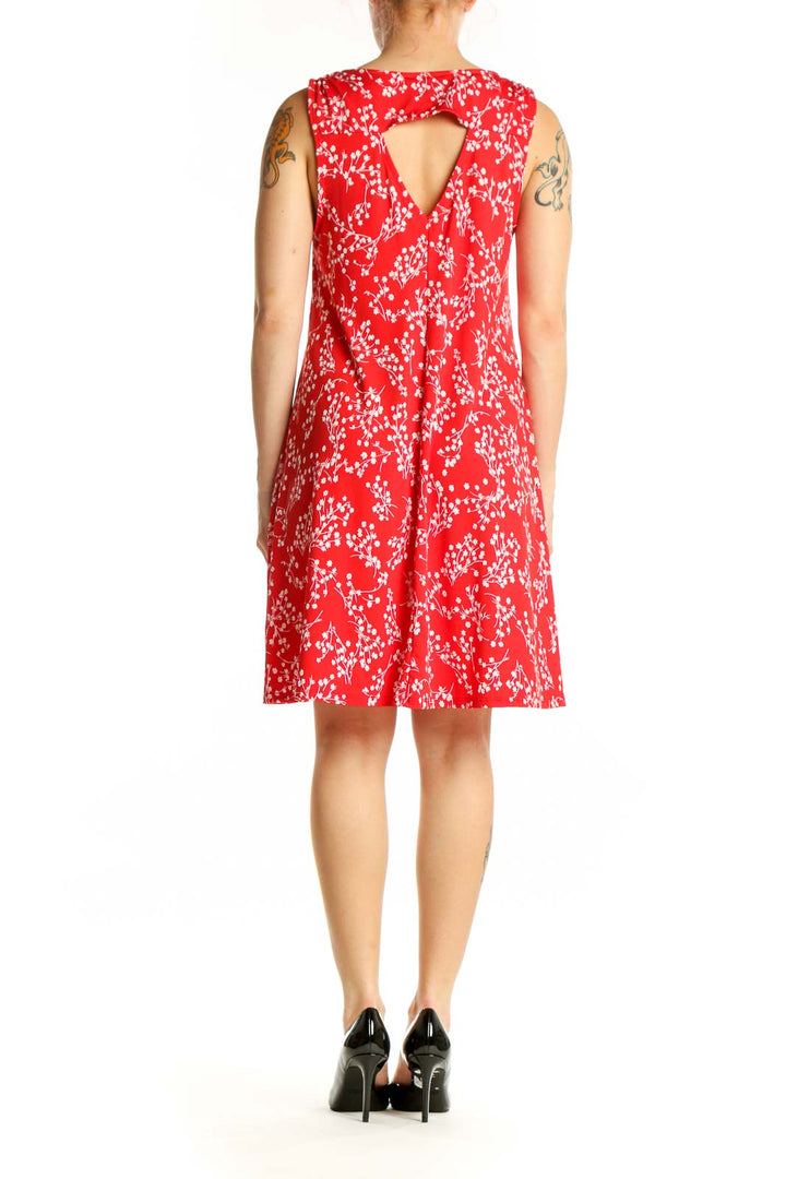 Red floral V-neck sleeveless A-line dress with white flower print, back view