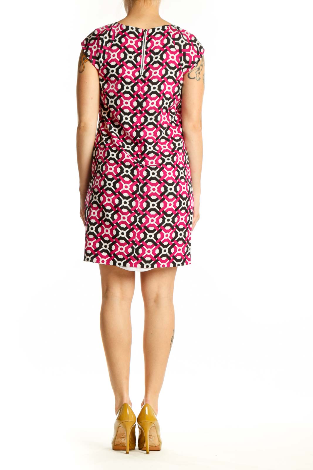 Back view of pink geometric print shift dress showing relaxed shift silhouette and knee-length cut