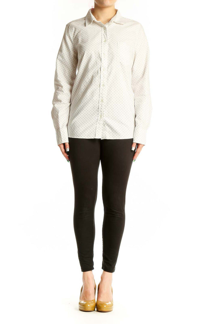 Front view of cream polka dot J.Crew cotton button-up shirt with collared neckline and long sleeves