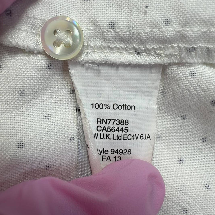 Tag view of cream polka dot J.Crew cotton button-up shirt showing button-front closure and relaxed fit