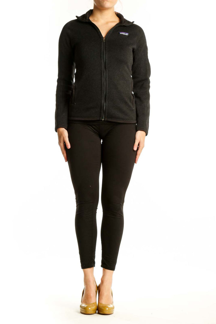 Patagonia black recycled polyester zip-up hoodie front view on model, XS size with full-zip closure and hooded neckline
