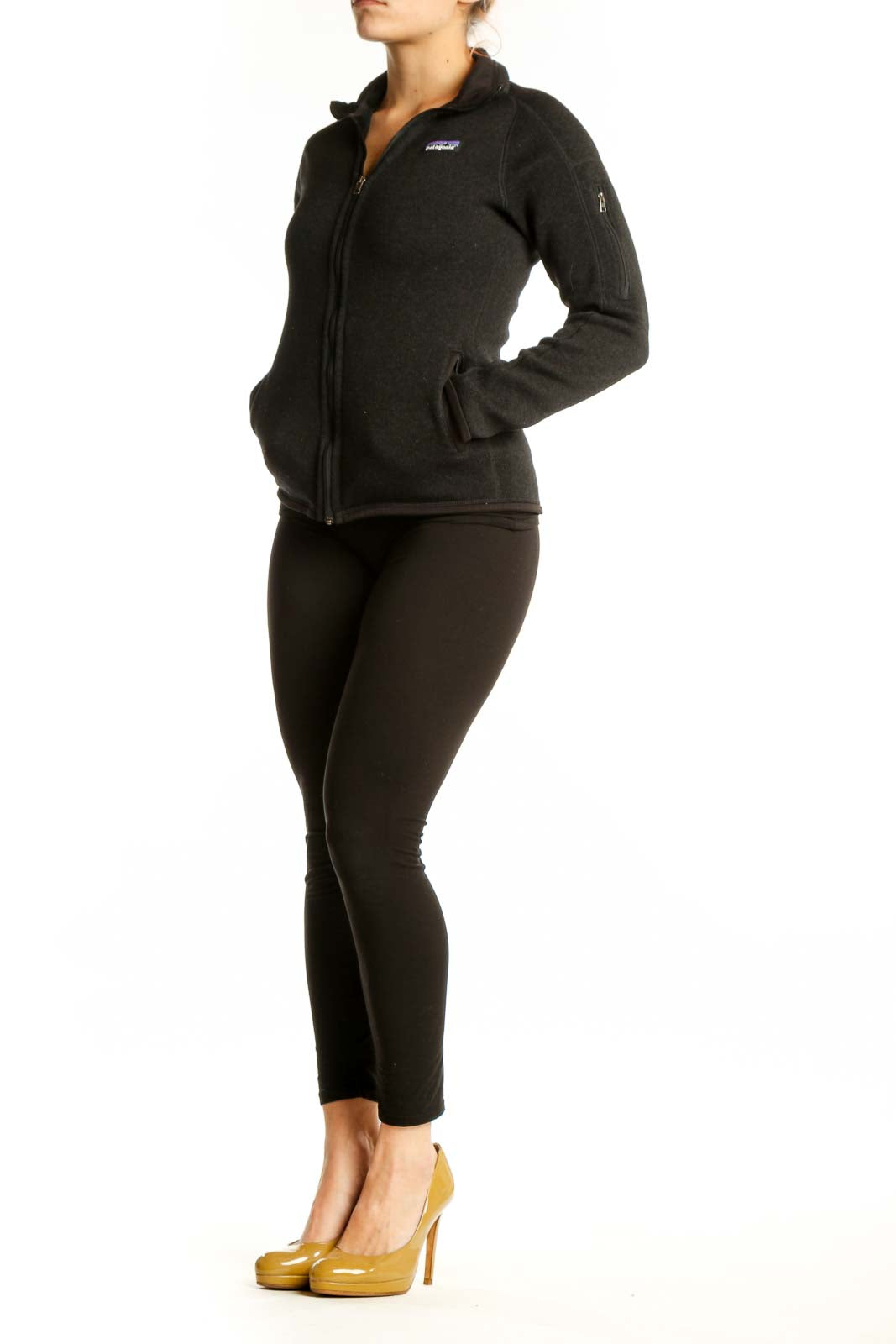 Patagonia black recycled polyester zip-up hoodie front view on model, XS size with full-zip closure and hooded neckline
