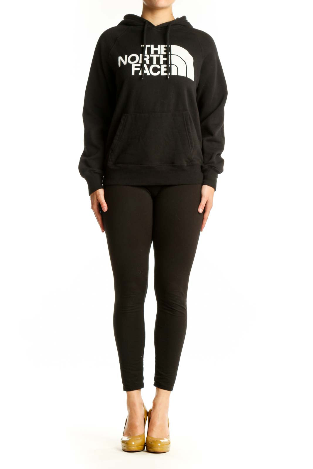 Black The North Face hoodie with white logo on front, worn by model showing kangaroo pocket and drawstring hood