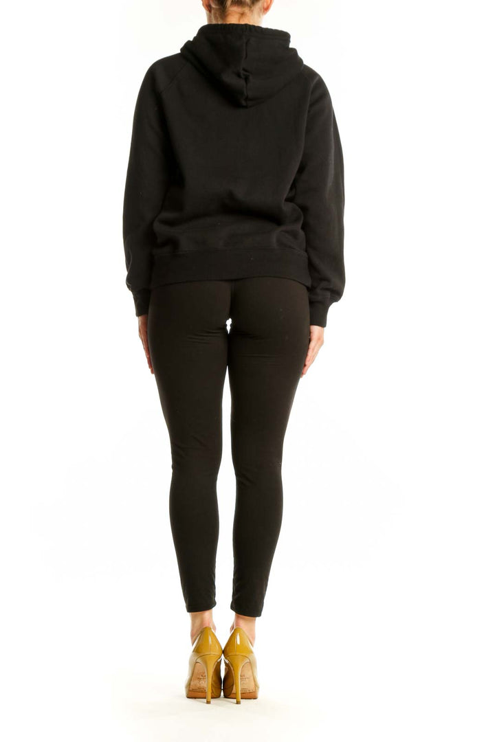 Back view of black The North Face hoodie displaying logo placement and relaxed fit silhouette