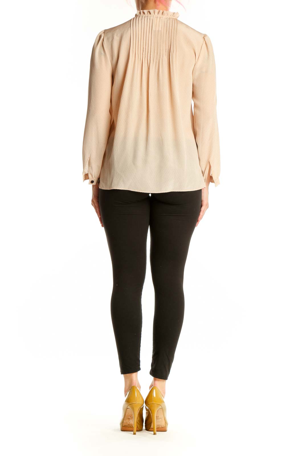 Back view of cream silk pleated blouse showing relaxed fit and long sleeves