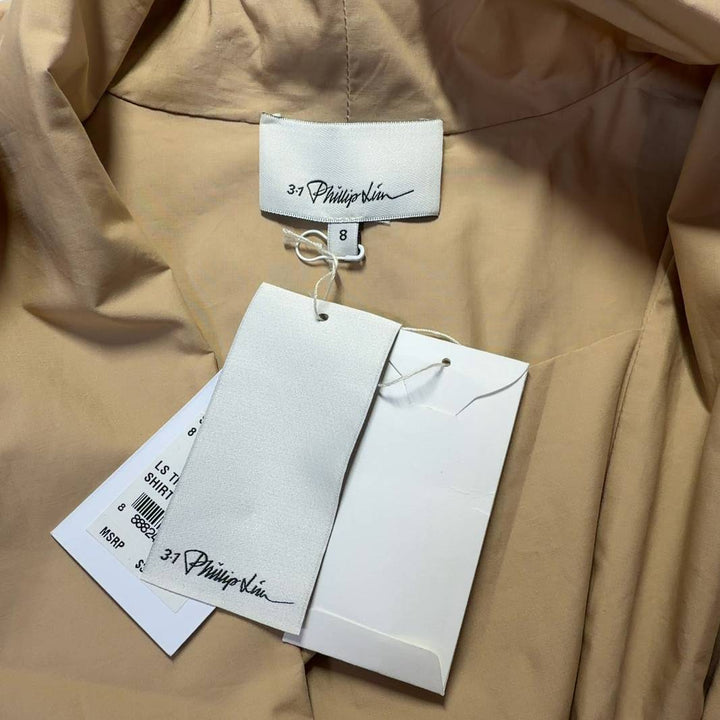 Beige cotton tie-front blouse with long sleeves, back view showing elegant drape