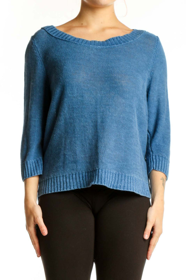 Blue linen knit sweater with crew neckline and three-quarter sleeves, front view on model