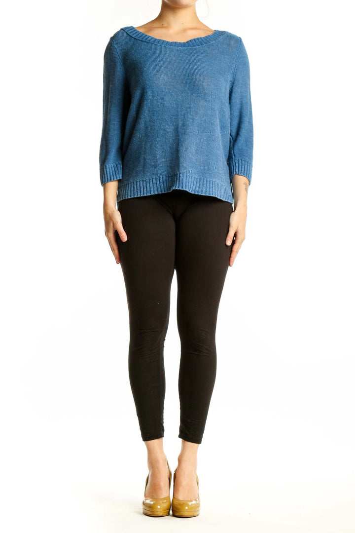 Blue linen knit sweater with crew neckline and three-quarter sleeves, front view on model