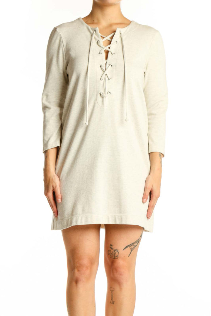 Cream lace-up long sleeve shift dress with bohemian front detail, front view