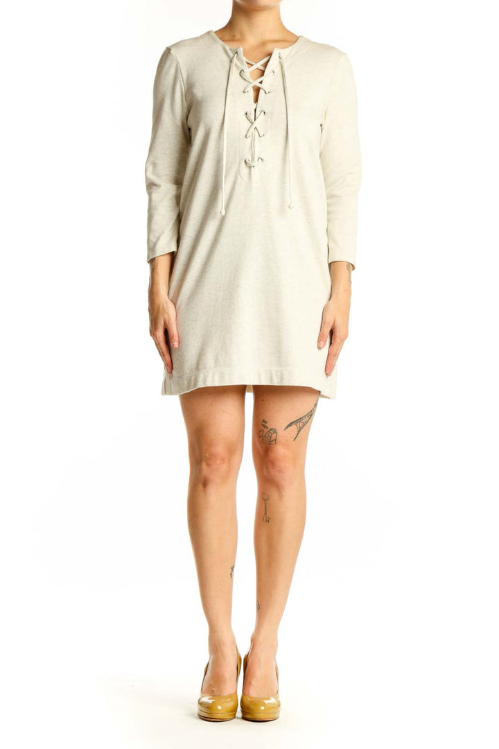 Cream lace-up long sleeve shift dress with bohemian front detail, front view