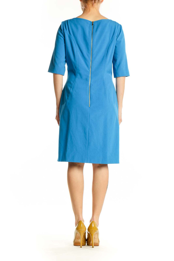 Back view of blue A-line half sleeve dress showing vertical seaming detail by Tahari Arthur S. Levine