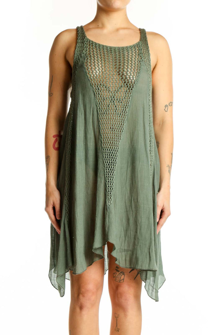 Front view of sage green mesh overlay asymmetrical tank dress by Elan with textured chest panel