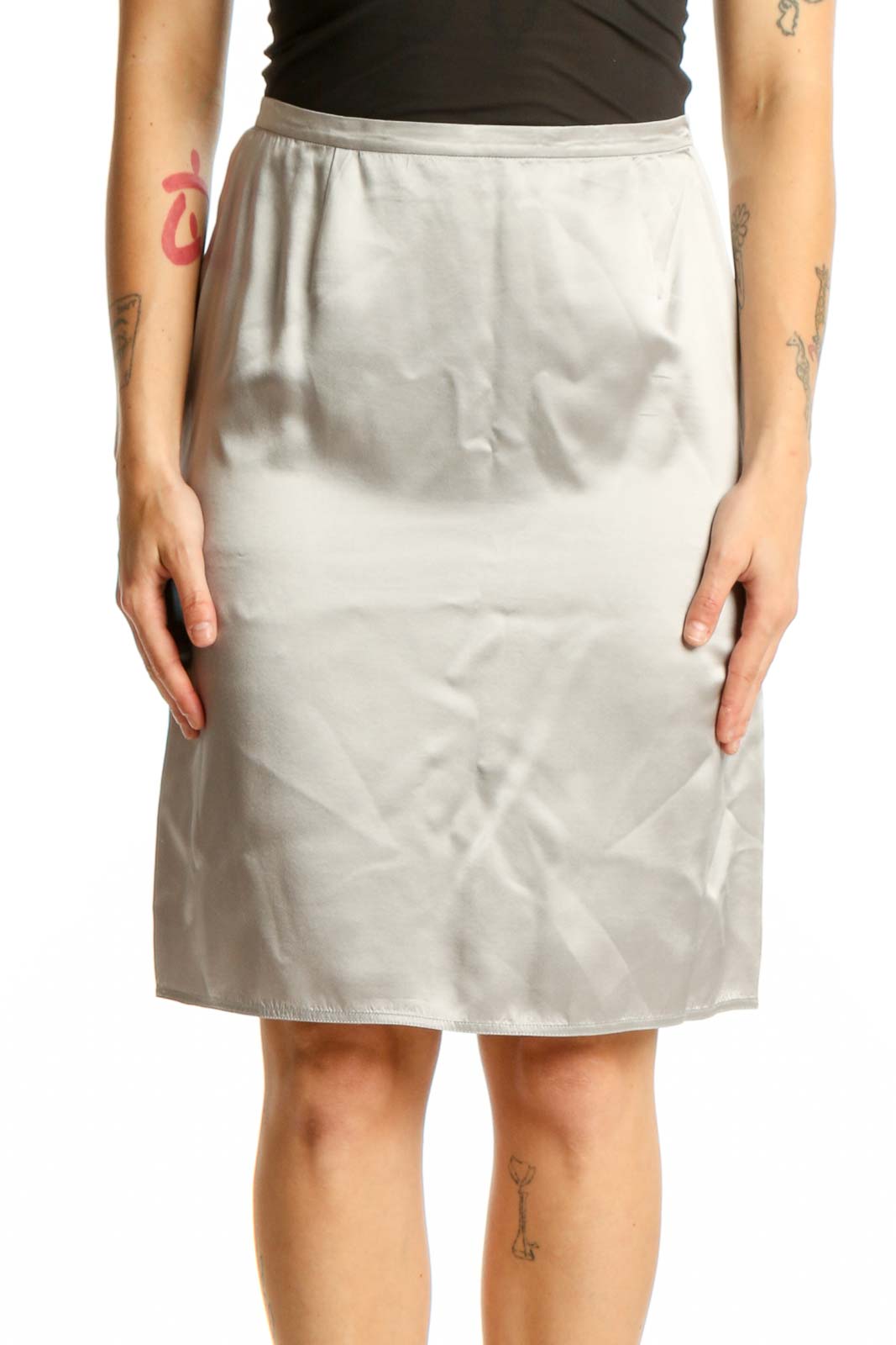 Cream silk pencil skirt front view, showing tailored fit and knee-length silhouette