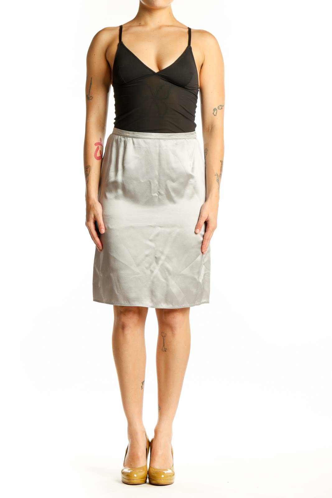 Cream silk pencil skirt front view, showing tailored fit and knee-length silhouette