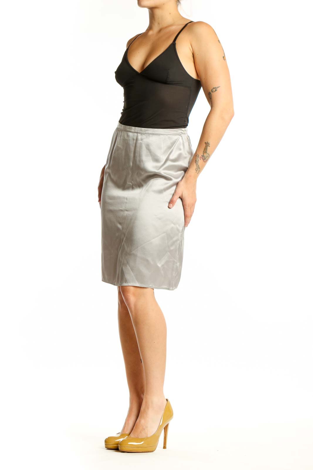 Cream silk pencil skirt front view, showing tailored fit and knee-length silhouette