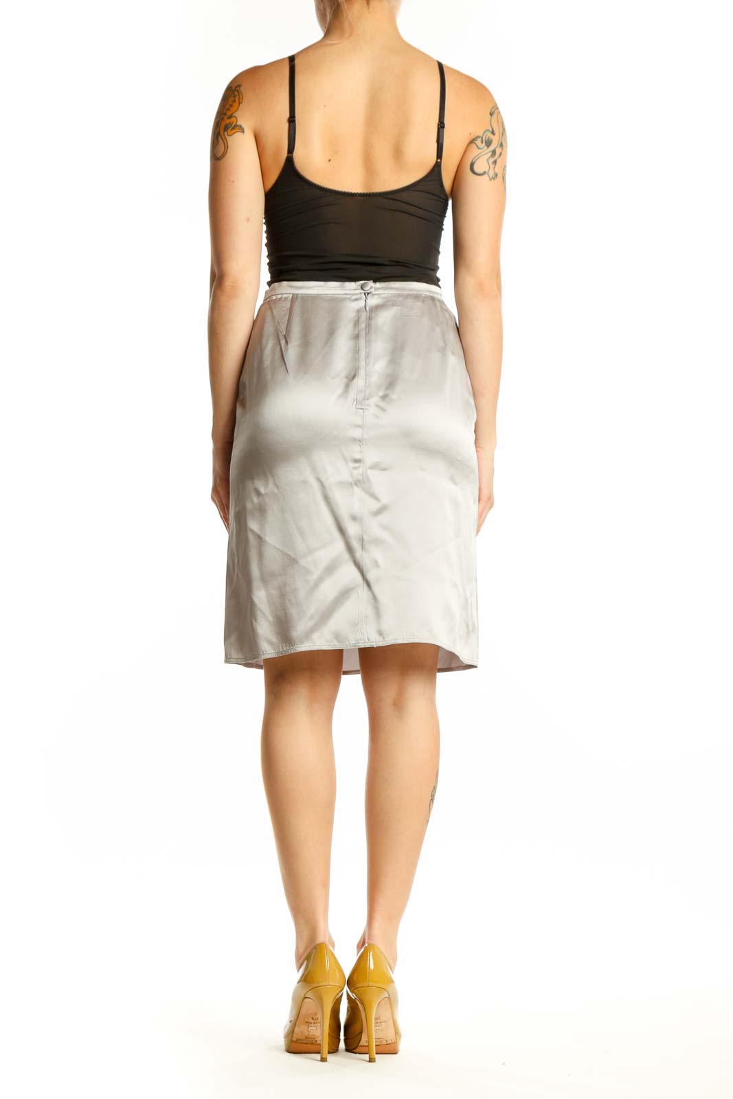Cream silk pencil skirt back view, displaying elegant drape and classic straight cut design