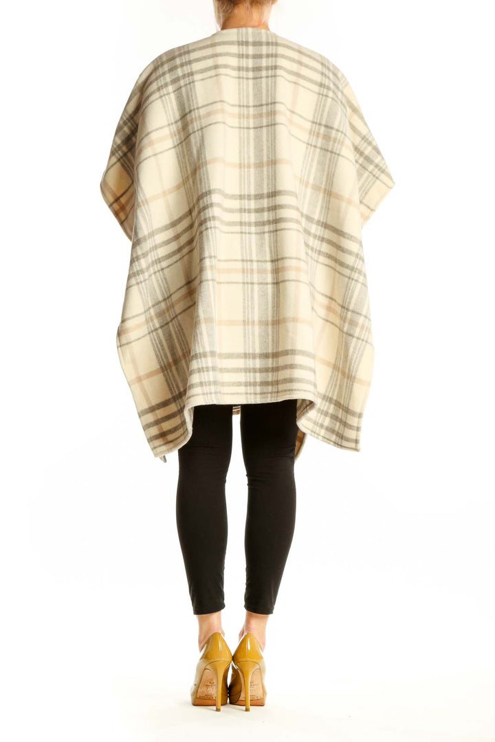 Back view of cream plaid kimono cardigan showing relaxed drape and flutter sleeve detail