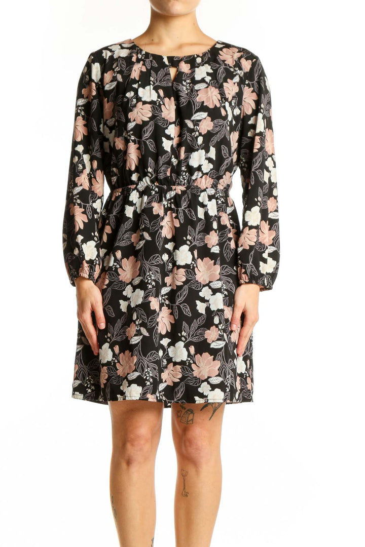 Black floral puff sleeve dress with pink and cream flowers, front view on model