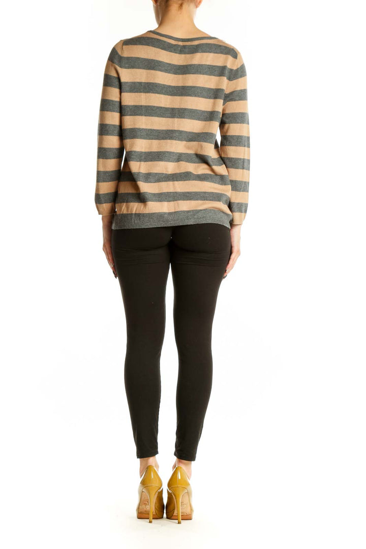 Beige and charcoal striped sweater with rhinestone embellished neckline, back view